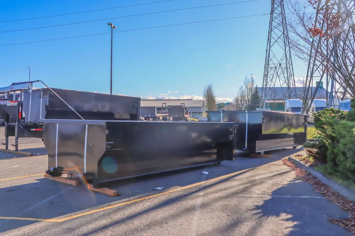 Roll-off dumpster ready for waste disposal at job site for 10 Yard Dumpster Rental in Pella